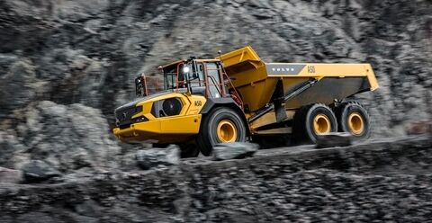 A Volvo A45 articulated hauler is travelling downhill in a quarry environment