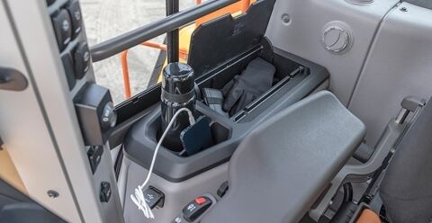 Volvo L180 wheel loader cup holder and storage locker in the cab