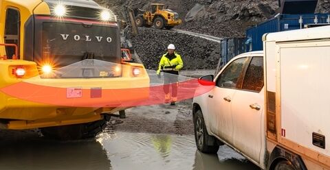 Collision mitigation system alerts a Volvo wheel loader to the danger of a parked service van