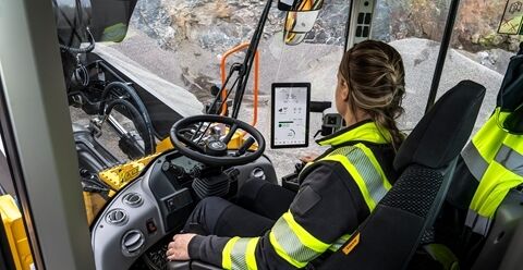 Operator inside Volvo wheel loader looking at Load Assist on Volvo Co-Pilot screen