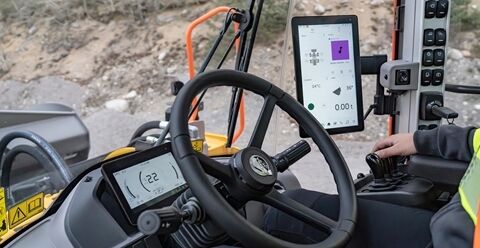 Close up of operator hand on controls of Volvo L220 wheel loader