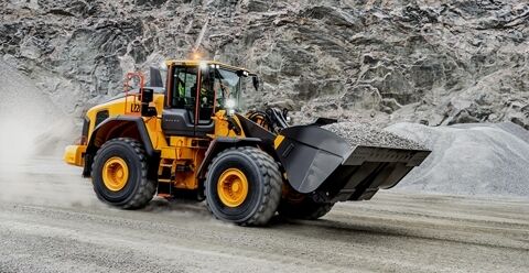 Volvo L220 wheel loader travelling downhill in a quarry