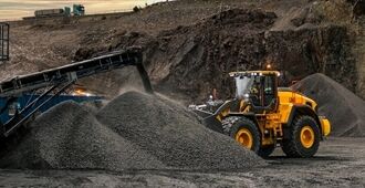Volvo L260 Wheel Loader loading gravels from pile in quarry