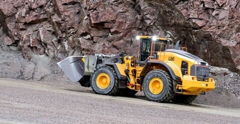 Volvo L260 wheel loader loading from pile in quarry