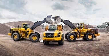Both L350F and L350H wheel loaders loading a Volvo articulated hauler.