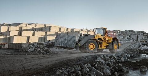 A Volvo L350H wheel loader in block handling configuration.