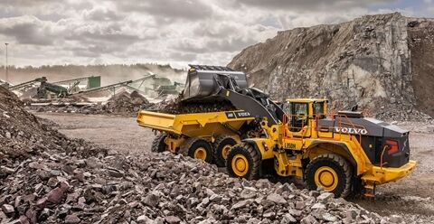 Rear view of the L350h wheel loader in rock handling purpose configuration.