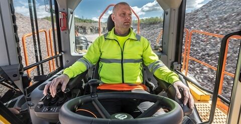 Wide view of the L350H cabin showing the excellent positioning of controls & switches for the operator hands.