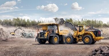 Side view of wheel loader L350H loading a Volvo Rigid dump truck.